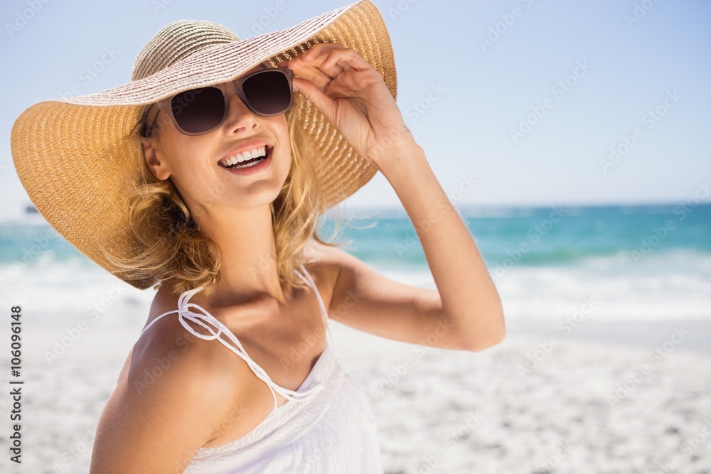 Portrait of blonde woman with straw hat