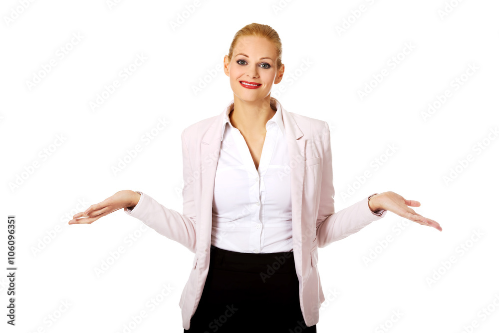 Young business woman shrugging with I dont know gesture Young business woman shrugging with I dont know gesture