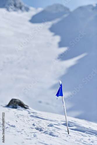 Blue flag on a mountain in winter
