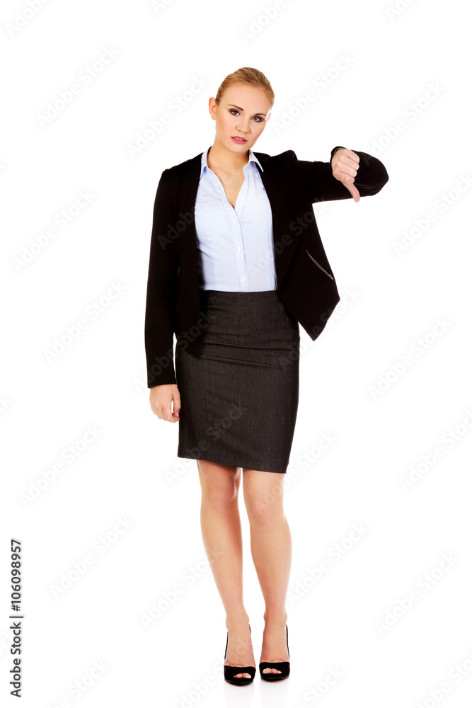 Unhappy businesswoman with thumbs down gesture Unhappy businesswoman with thumbs down gesture
