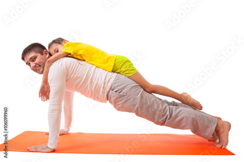 dad practicing yoga with daughter isolated photo