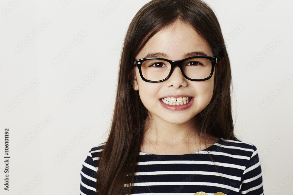 Smiling young girl in glasses, portrait