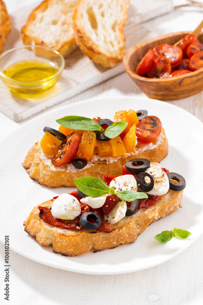 bruschettas with tomatoes and mozzarella, top view vertical