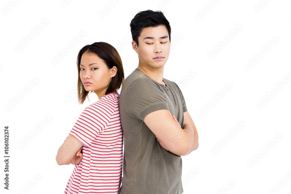 Depressed couple standing back to back Depressed couple standing back to back
