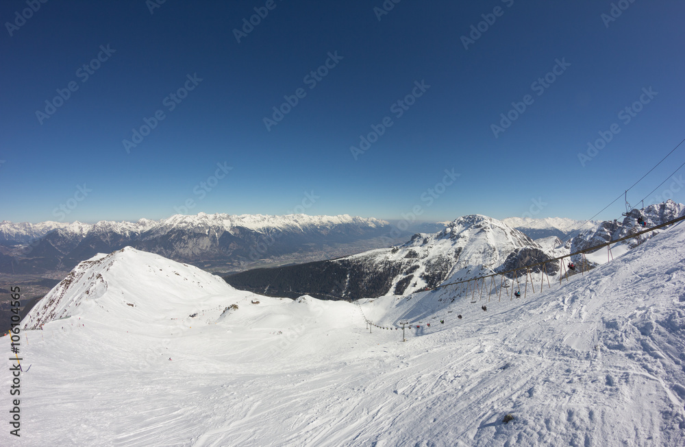 Skiing At Axamer Lizum With View To Innsbruck In Tyrol Austria