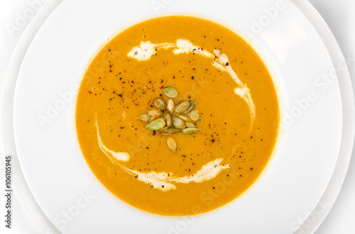 Pumpkin soup with cream, herb and pumpkin seeds