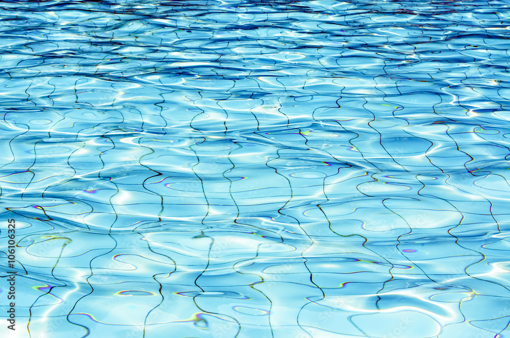 Fototapeta premium Background of rippled water in swimming pool / Blue ripped water in swimming pool (swimming, pool, wave)