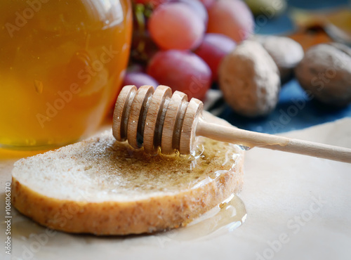 bread with honey, grapes, nuts and apples