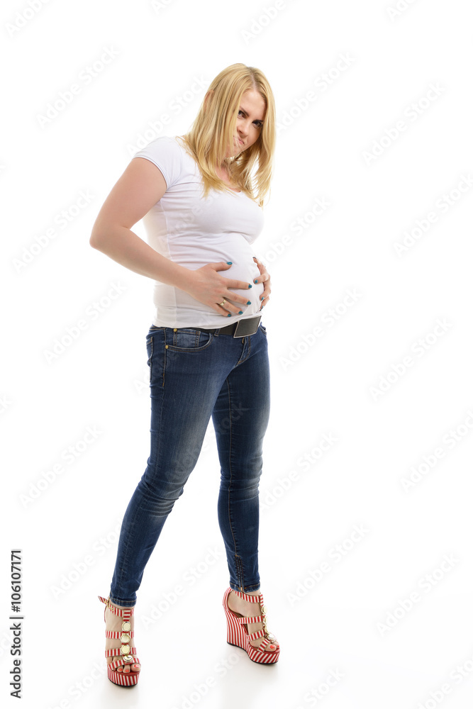 Overweight young woman touching her belly, over white background Overweight young woman touching her belly, over white background