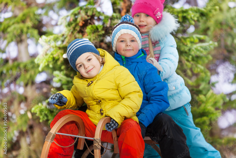 Close portrait of boys and girls on sledge Close portrait of boys and girls on sledge