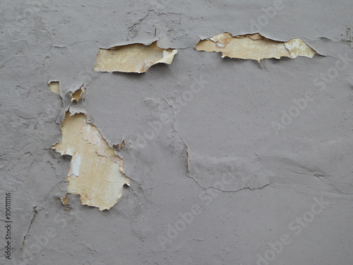 Peeling paint on a concrete wall