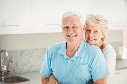 Portrait of senior woman embracing husband