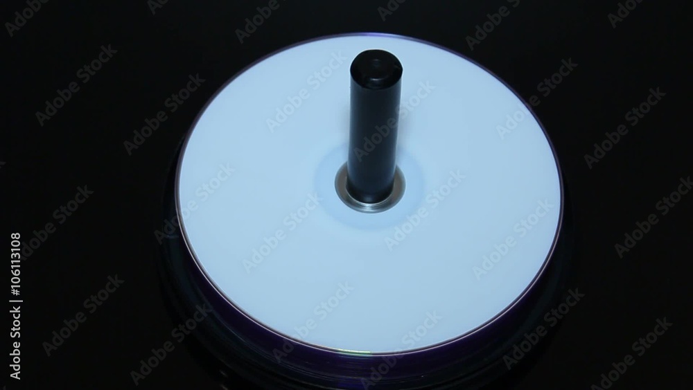DVD disks swirling on a black background . Arm DVD disks swirling on a black background . Arm