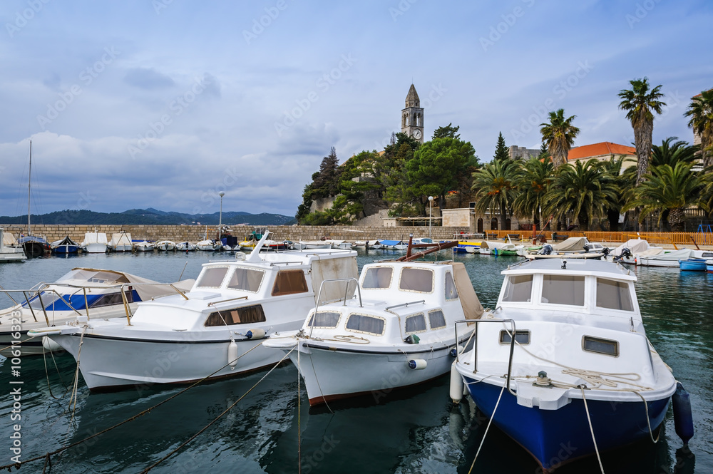 Harbor on Lopud Island with the Franciscan monastery on the background, Croatia