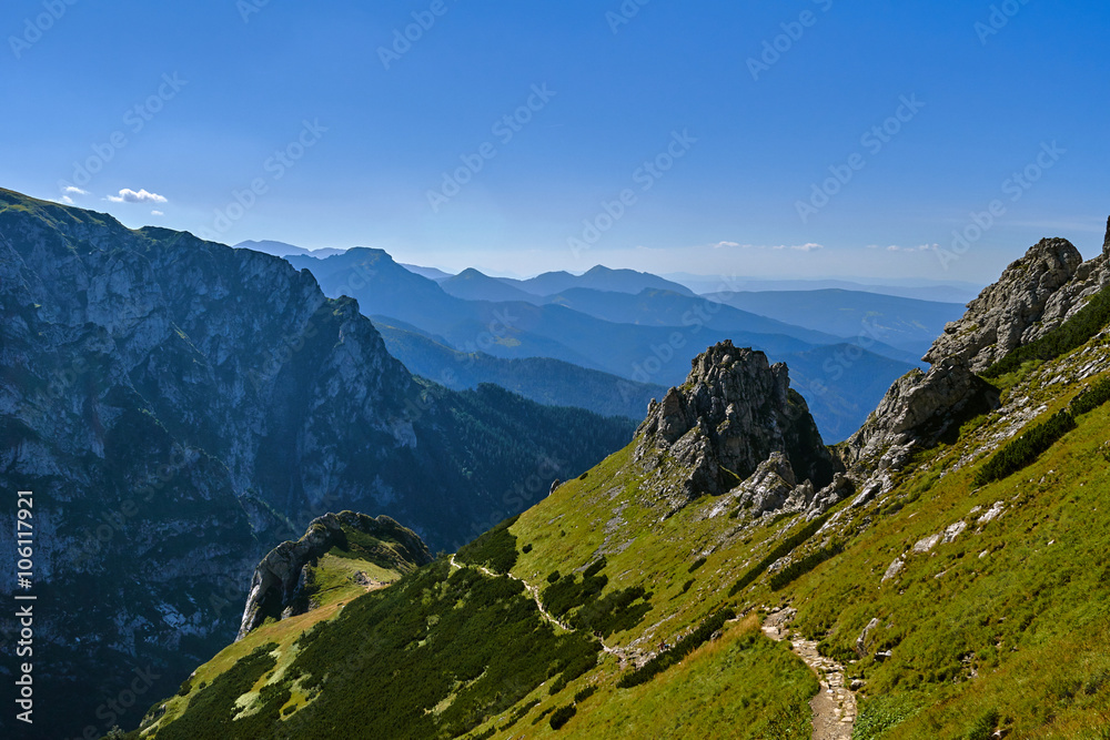 Fototapeta premium People on the tourist trail on the mountain peaks in the Western Tatras in Poland.
