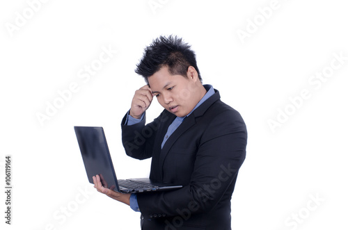 Portrait of young businessman with laptop isolated over white ba