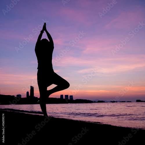 Silhouette Asia woman yoga