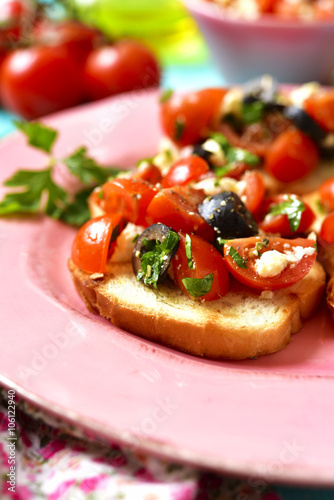 Crostini with tomatoes,feta and olives.