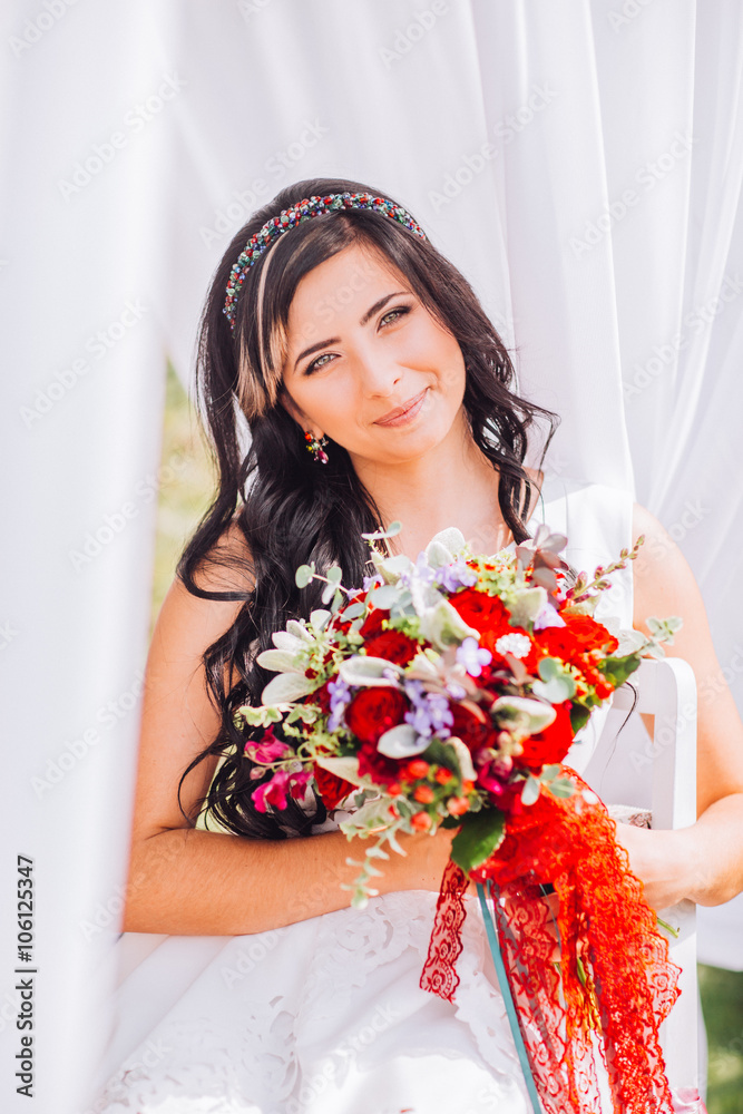 Portrait of beautiful girl with bouquet of flowers.Attractive girl with flowers,sitting ear the red,clean lake.Nice girl with unusual,creative,.Lovely,pretty girl hold in hands flowers. Portrait of beautiful girl with bouquet of flowers.Attractive girl with flowers,sitting ear the red,clean lake.Nice girl with unusual,creative,.Lovely,pretty girl hold in hands flowers.