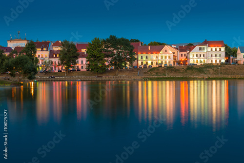beautiful houses on the river bank at sunset