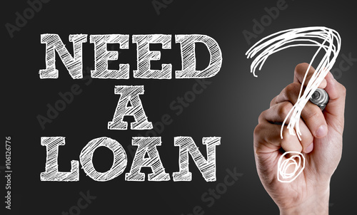 Hand writing the text: Need a Loan? photo