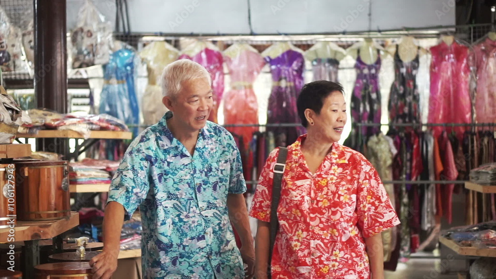 Asian senior tourist walking and shopping for local craft in Thailand Asian senior tourist walking and shopping for local craft in Thailand
