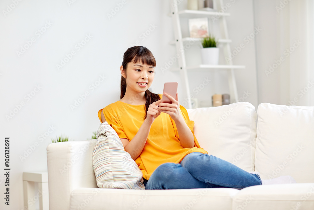 happy asian woman with smartphone at home happy asian woman with smartphone at home