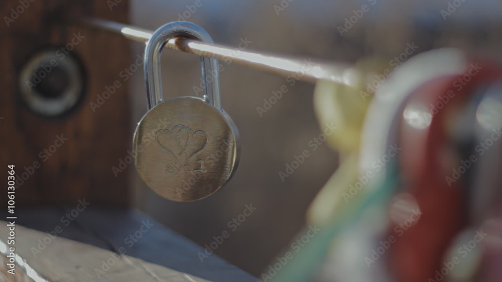 padlock on the bridge of a loving couple