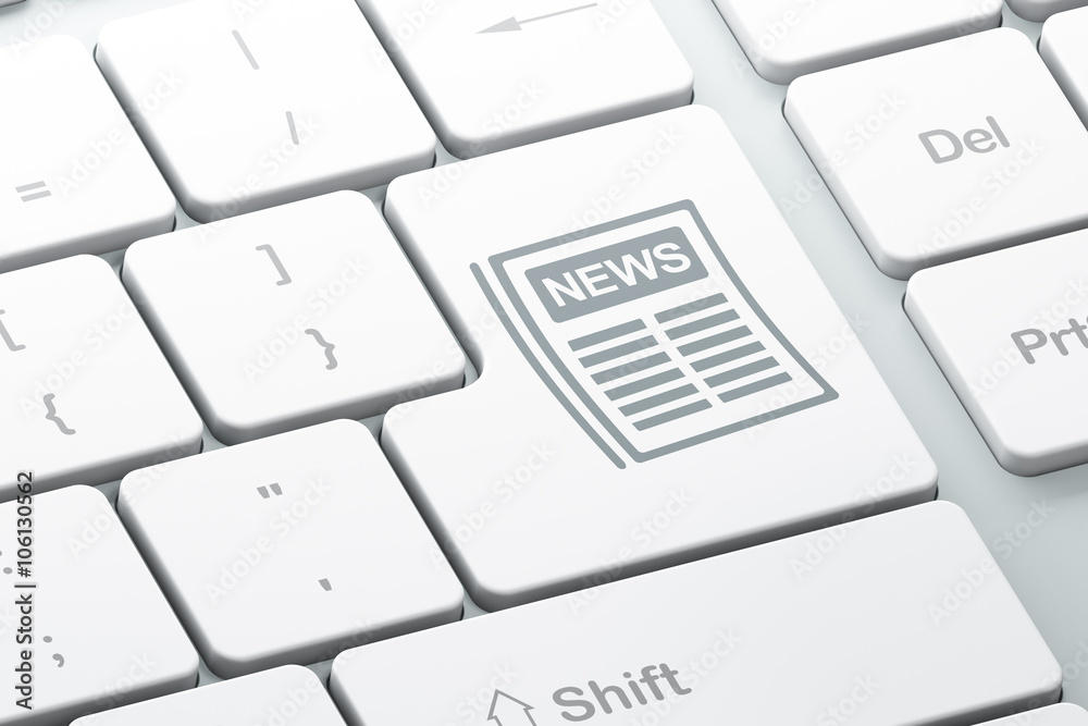 News concept: Newspaper on computer keyboard background