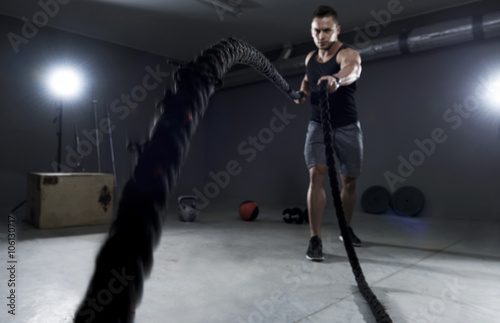 Battle ropes exercise in the garage