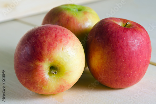 Apple isolated on wooden board background