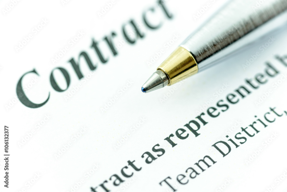 Blue ballpoint pen on a contract, ready to sign and fill a form. Blue ballpoint pen on a contract, ready to sign and fill a form.