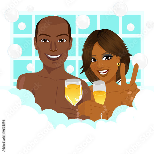 A young african american couple taking a bath with champagne
