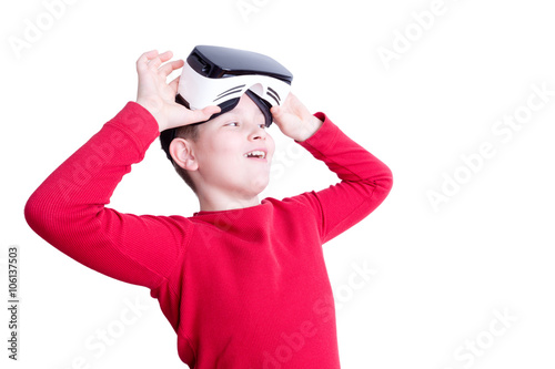 Child lifts up virtual reality headset to see