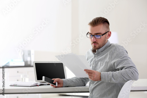 Businessman working with la...