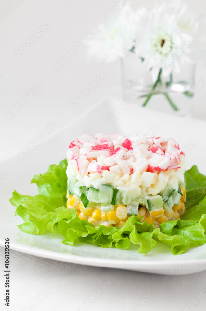 Crab sticks salad on white tablecloth Crab sticks salad on white tablecloth