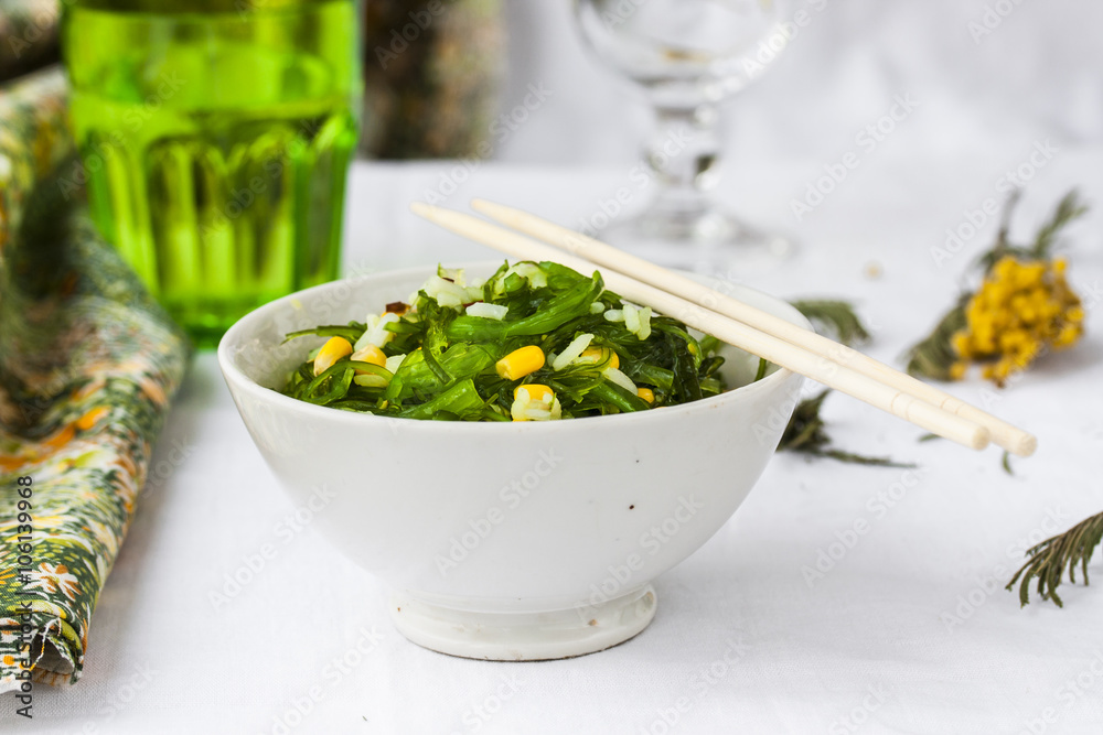 Chuka seaweed salad garnished with rice and corn Chuka seaweed salad garnished with rice and corn