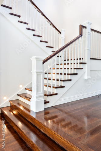 Stairs and glossy wooden floor of beautiful attractive luxury ho