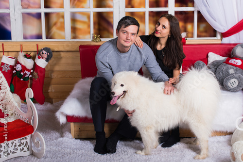 Fototapeta Naklejka Na Ścianę i Meble -  The guy with the dog, Happy family with dog, Girl with dog, Girl with Christmas present