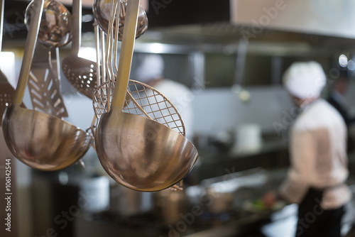 kitchen accessories with chefs in the background