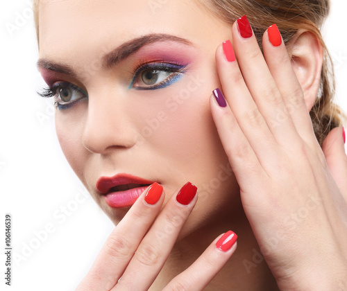 Beautiful girl with colorful makeup and manicure, isolated on white