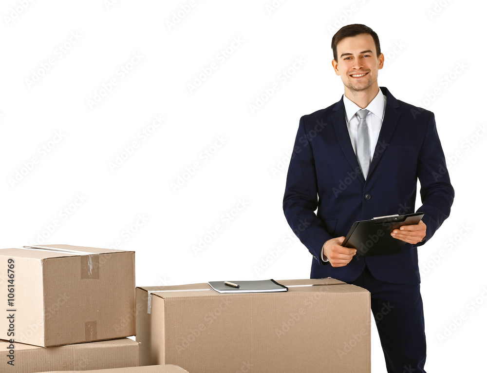 Delivery concept. Man in black suit with carton boxes isolated on white background Delivery concept. Man in black suit with carton boxes isolated on white background