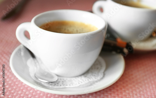 Cups of coffee on table in cafe, close up