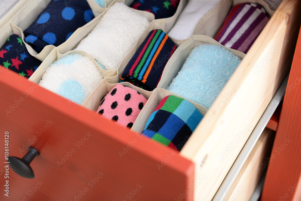 Folded clothes in chest of drawers closeup Folded clothes in chest of drawers closeup