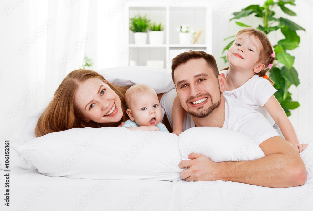 happy family at home in the bed happy family at home in the bed