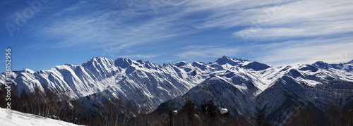 Panoramic view on sunlight snowy mountains in nice morning © BSANI