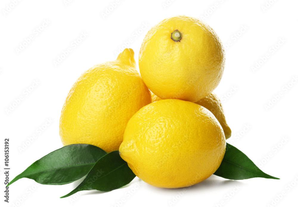 Fresh lemons with green leaves isolated on white