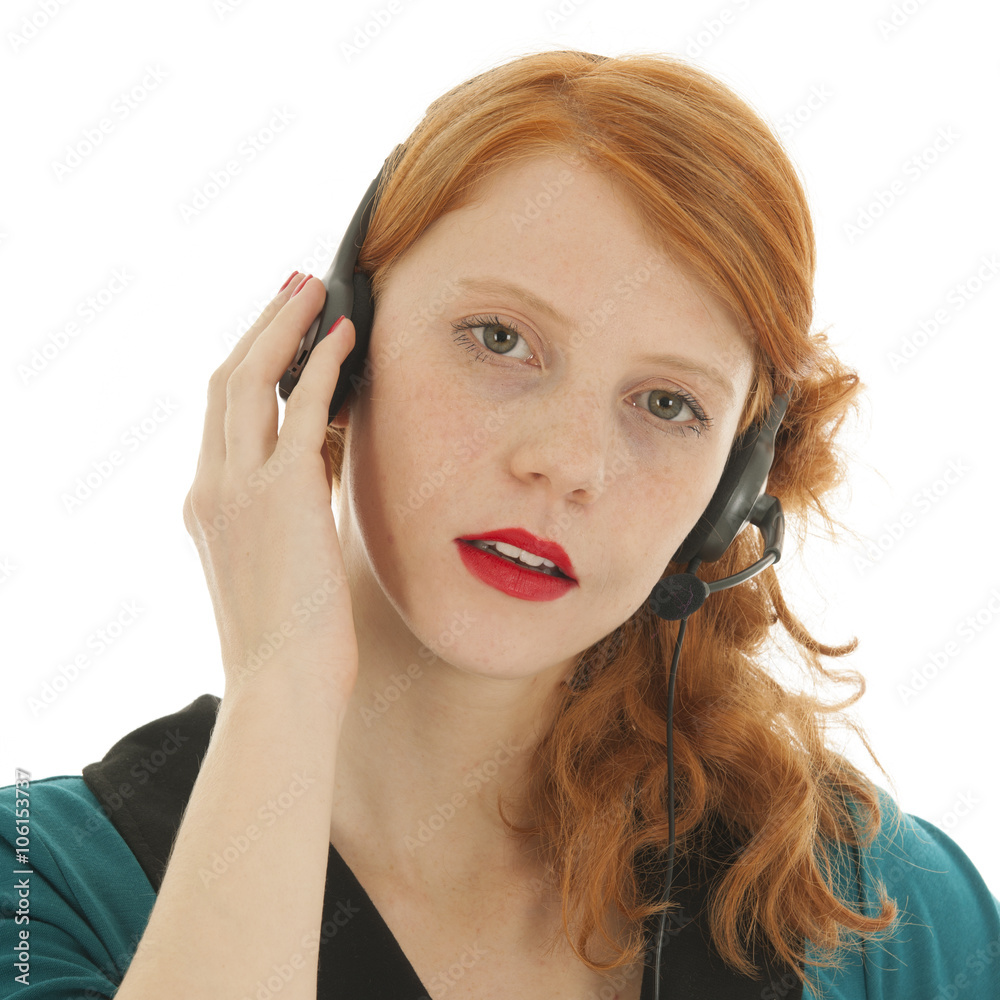 Young red haired woman with head set