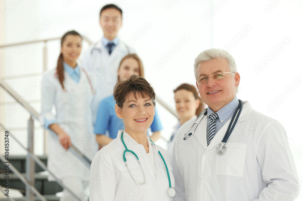 Team of smiling doctors indoors