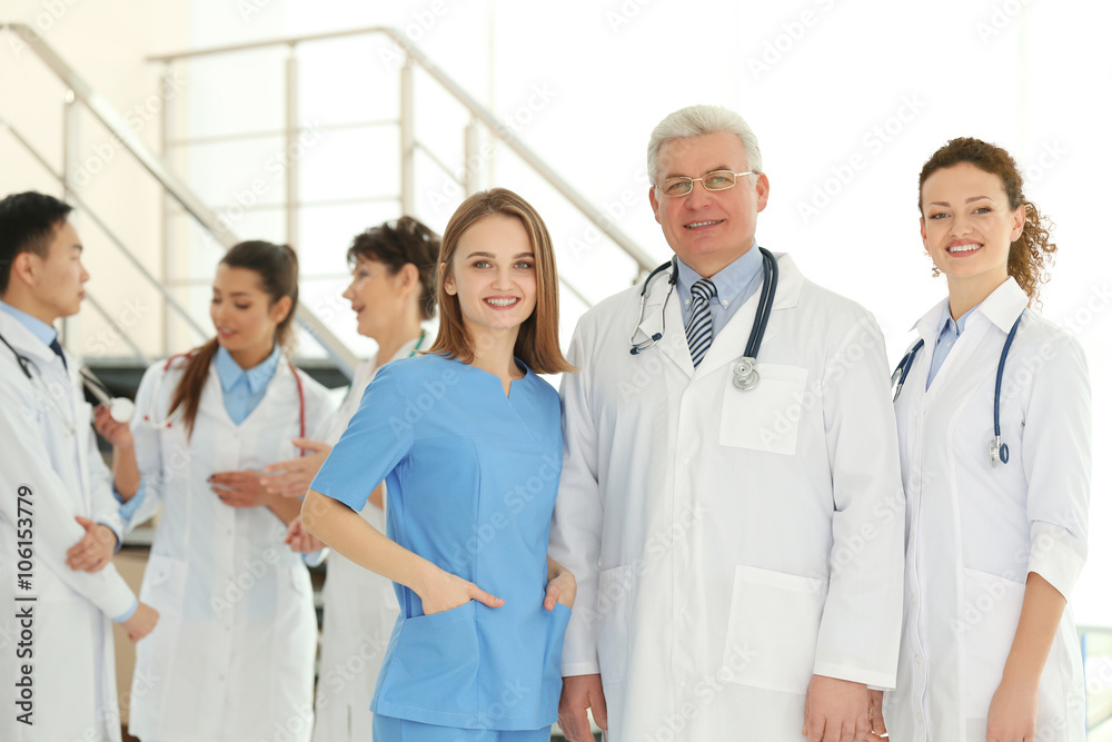 Team of smiling doctors indoors Team of smiling doctors indoors